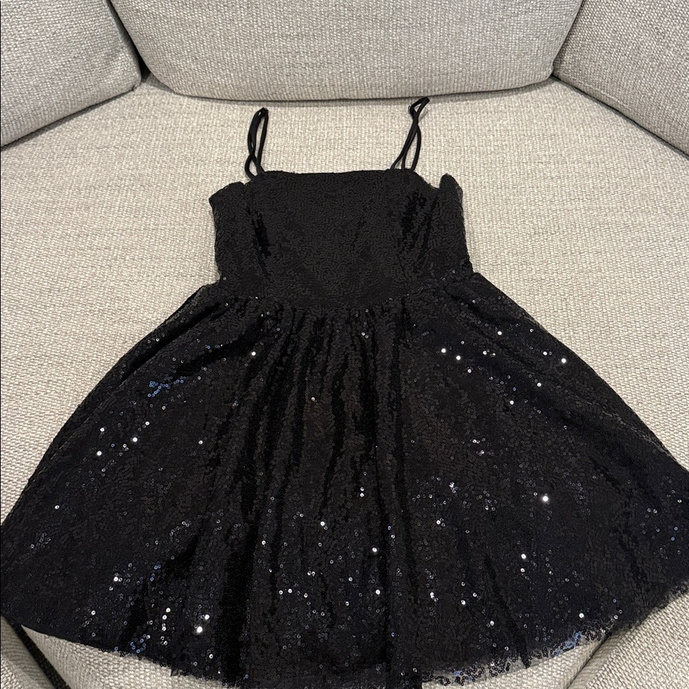 “Miss Behave Girls” open back, strapped sequins dress.